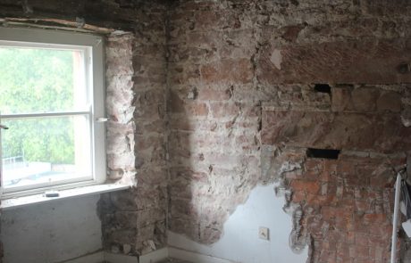 Stripped back wall upstairs showing stone and brick #ReadyForRain 33a Chapel St