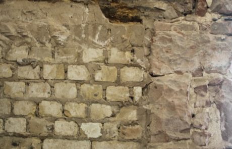 One of the inside walls with the cement render removed, revealing brick and stone at 33a Chapel St