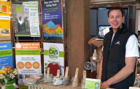 Chris Morphet from Lake District Lime with lime products at Cumbria Life Home and Garden Show 2018