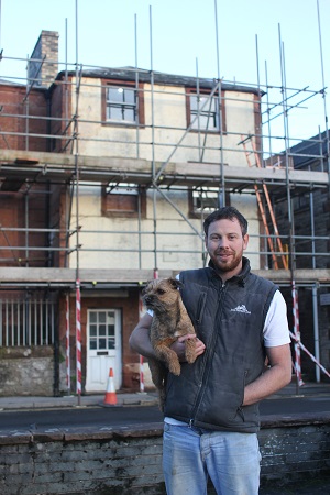 Chris Morphet and Nettle outside 33a Chapel St with scaffolding up at the front of the house