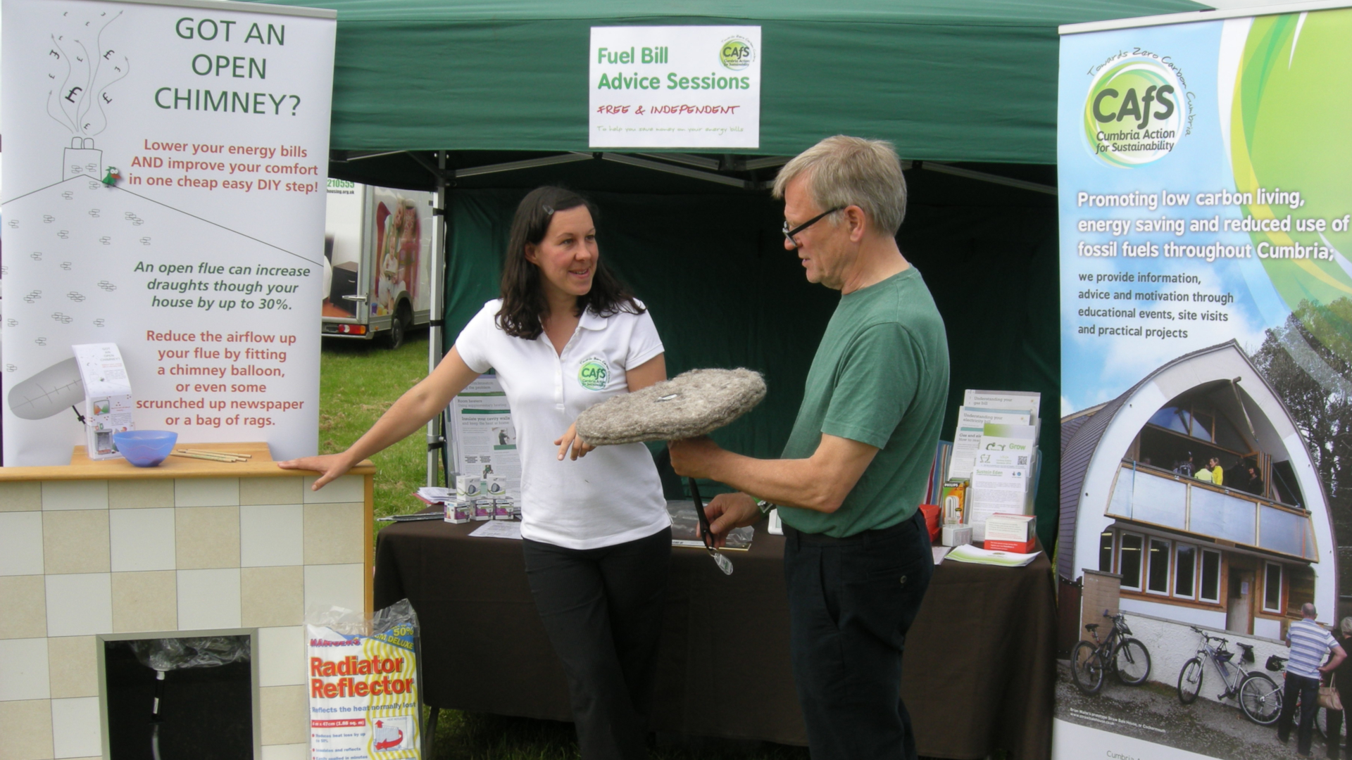 CAfS chief executive Hazel Graham offers advice on blocking chimney draughts using a Chimney Sheep, at a stall at an event
