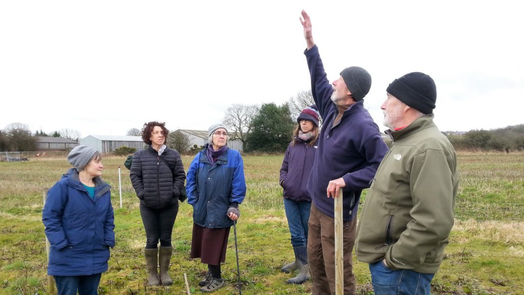 The Alston Moor community-led food growing team are shown around on a visit to the Gibside community farm