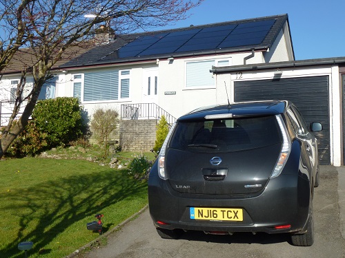 A Nissan Leaf electric car and solar PV panels at a highly energy-efficient bungalow near Kendal