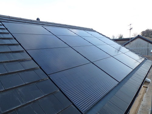 Integrated solar PV panels on the roof of a highly energy-efficient bungalow at Endmoor near Kendal