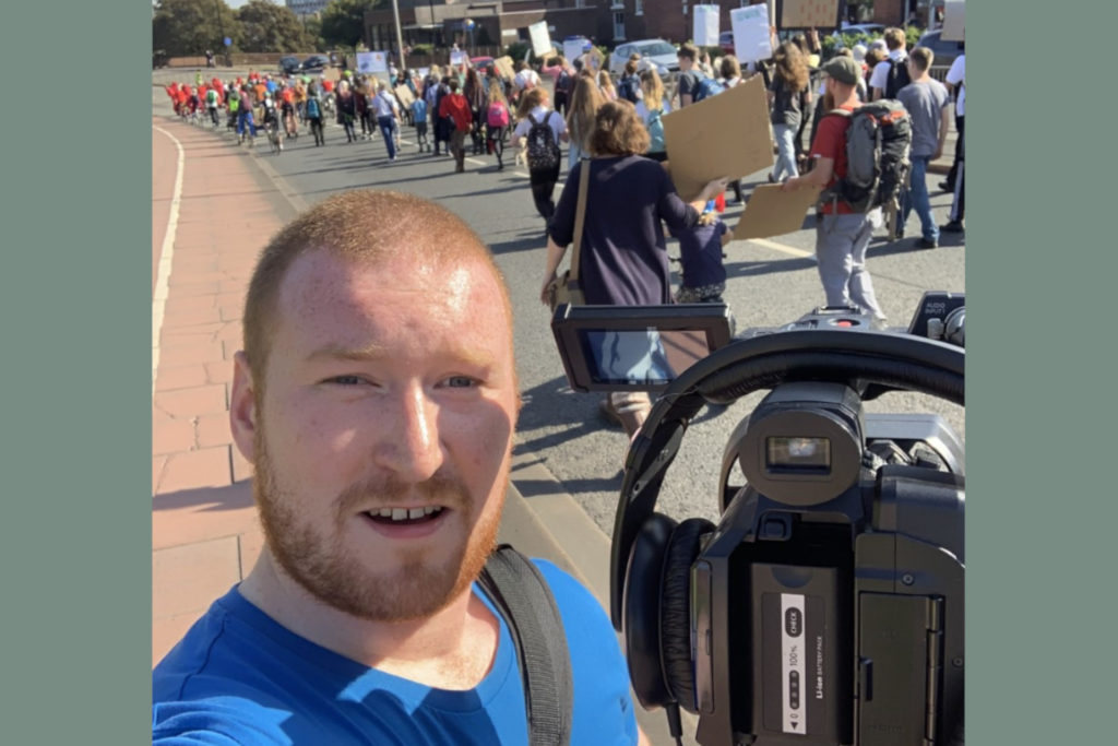 Kieran Macfadzean pictured filming Carlisle's Climate Strike in September 2019
