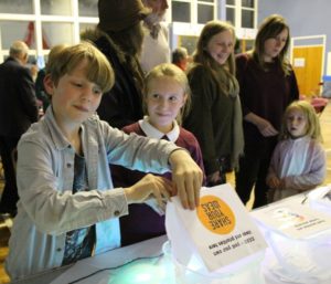 A boy casts a vote in community consultation as part of Alston Moor Greenprint project by CAfS