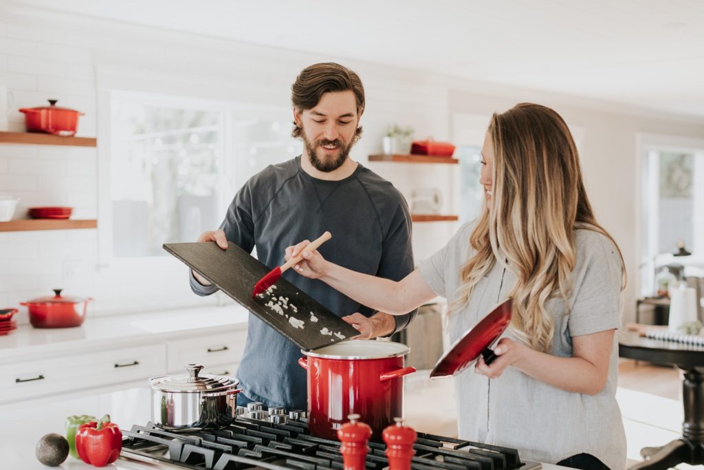 A man and a woman cooking together - Becca Tapert via Unsplash