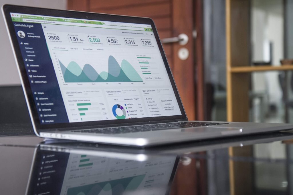 Laptop with graphs on screen on a table