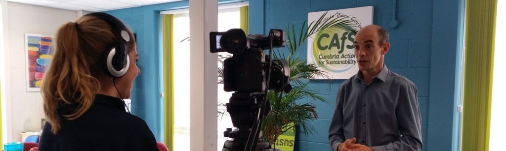 A CAfS team member being interviewed by a TV reporter on carmera