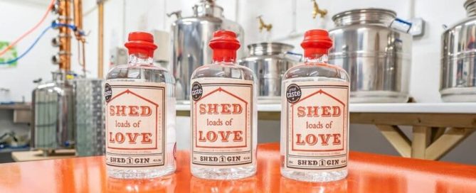 Three Bottles of Shed 1 Gin in the distillery