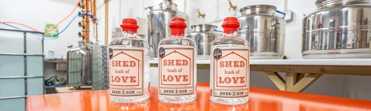 Three Bottles of Shed 1 Gin in the distillery