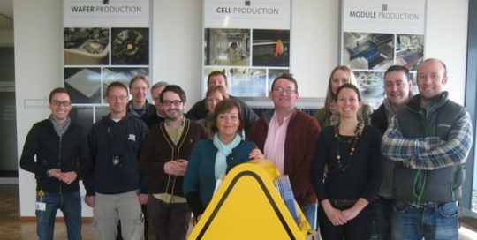 A group of people visiting a manufacturing company in Germany