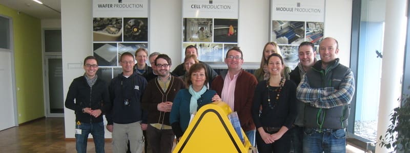 A group of people visiting a manufacturing company in Germany