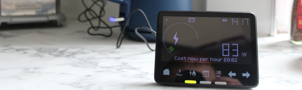 A smart meter display unit in front of a kettle