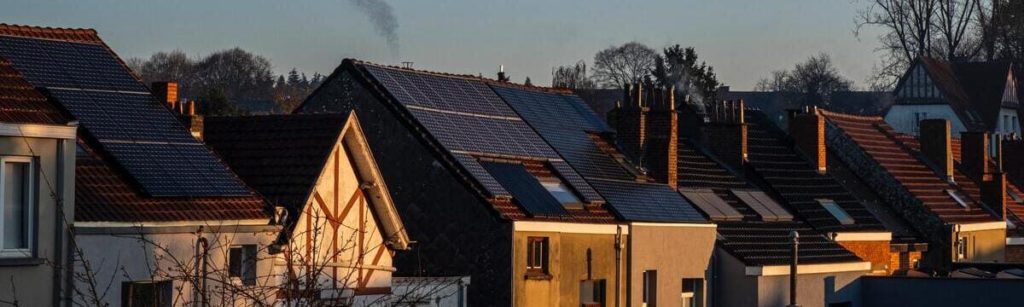 A row of houses with solar panels installed